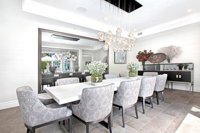 Inspiration for a mid-sized transitional kitchen/dining combo in Los Angeles with white walls and no fireplace.