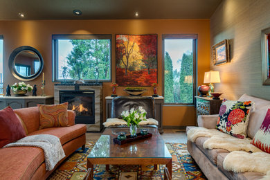Inspiration for a large transitional open concept laminate floor, brown floor, vaulted ceiling and wallpaper living room remodel in Portland with brown walls, a standard fireplace and a tile fireplace