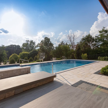 Burr Ridge Lap Pool with Raised Hot Tub and Waterfall