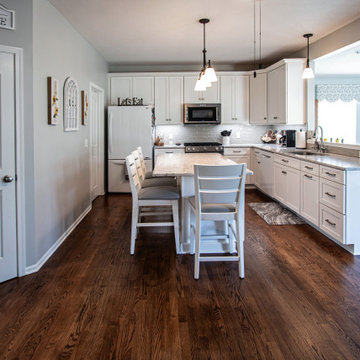 White Shaker Kitchen w/ Pietra Quartz Countertop and Gray Subway Tile Backsplash