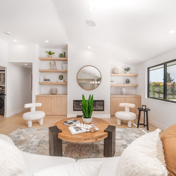 Oak Shelving Flanking the Fireplace Above Closed Storage