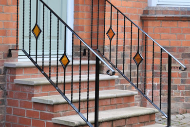 Wrought Iron Handrails with Glass detail