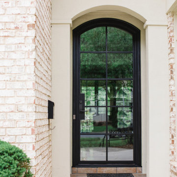 Inviting Entryway: Custom Iron Door with Windows