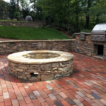 Natural Stone Retaining Wall, Brick Patio, Outdoor Grill & Fire Pit