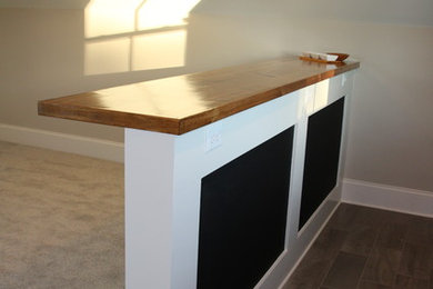 Inspiration for a country home bar in Raleigh with wood benchtops, ceramic floors and brown benchtop.