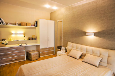 Inspiration for a mid-sized timeless master light wood floor bedroom remodel in Other with multicolored walls