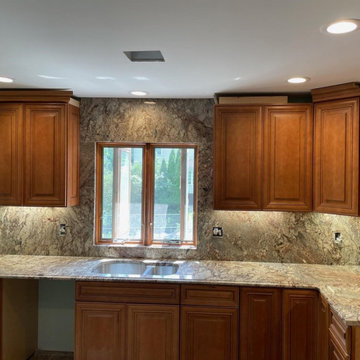 Typhoon Bordeaux Kitchen Countertops with Full Height Backsplashes