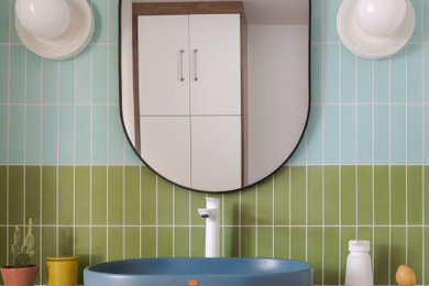 Example of a 1960s multicolored tile porcelain tile and gray floor powder room design in Denver with dark wood cabinets, white walls, a vessel sink, quartz countertops, white countertops and a floating vanity