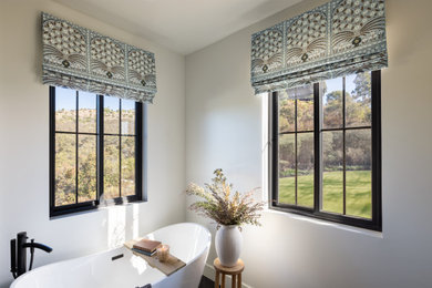 Inspiration for a transitional freestanding bathtub remodel in Atlanta with white walls