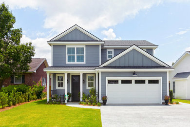 Inspiration for a farmhouse gray two-story wood exterior home remodel in Charleston with a shingle roof