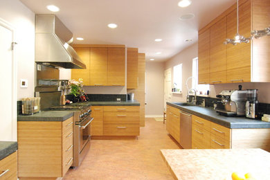 Kitchen pantry - mid-sized contemporary galley ceramic tile kitchen pantry idea in San Francisco with a single-bowl sink, flat-panel cabinets, light wood cabinets, concrete countertops, black backsplash, ceramic backsplash, stainless steel appliances and no island
