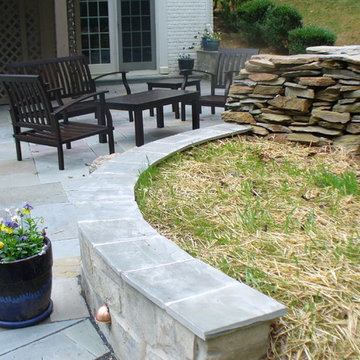 Custom Patio built around existing firepit with embedded lighting