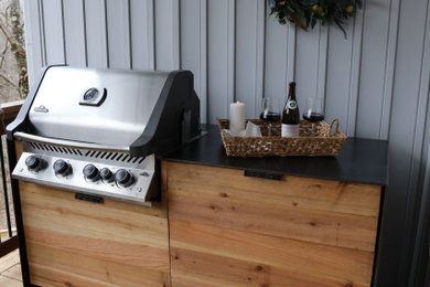 Inspiration for a modern outdoor kitchen deck remodel