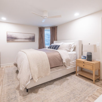 Warm & Inviting Basement Retreat with Custom Bar + Entertainment Center