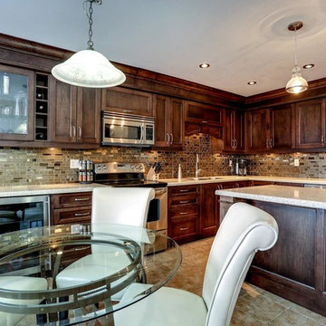 Contemporary kitchen with bronze backsplash