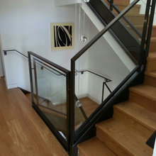 Stained minimalist handrail with glass