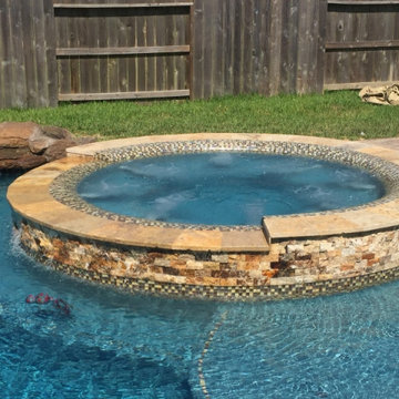 Signature Spa with Travertine Stone Surround and Glass Tile