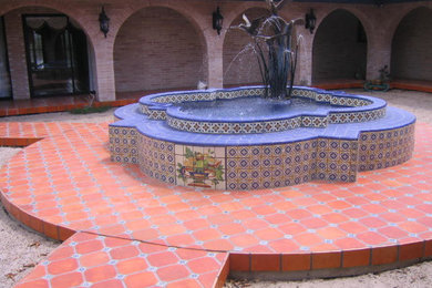 Example of a tuscan patio design in Austin