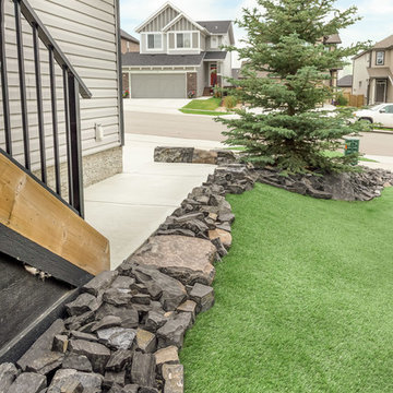Side & Front Yard with Low Maintenance Rock Tailings and Synthetic Turf