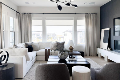 Living room - contemporary light wood floor, beige floor and wainscoting living room idea in Denver with black walls, a ribbon fireplace and a wall-mounted tv