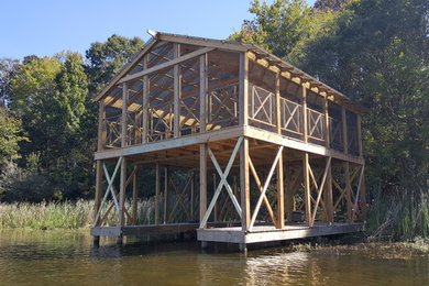 Example of a mountain style two-story gable roof design in Birmingham
