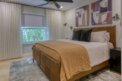 Example of a mid-sized transitional master travertine floor and beige floor bedroom design in Miami with white walls