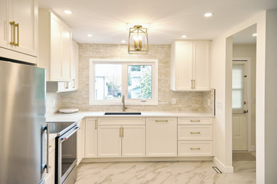 Inspiration for a mid-sized transitional l-shaped porcelain tile and beige floor eat-in kitchen remodel in Edmonton with an undermount sink, recessed-panel cabinets, white cabinets, quartzite countertops, beige backsplash, ceramic backsplash, stainless steel appliances, no island and white countertops