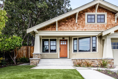 Example of an arts and crafts beige one-story mixed siding gable roof design in San Francisco