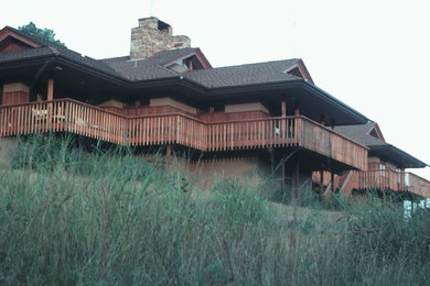 Inspiration for a large timeless beige two-story house exterior remodel in Other