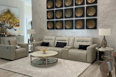 Example of a large transitional open concept porcelain tile, beige floor, vaulted ceiling and wallpaper family room design in Miami with beige walls and a wall-mounted tv