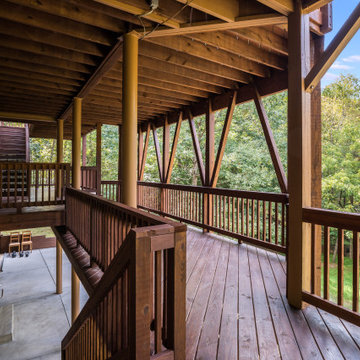 Multi-Level Covered Deck with Wood Railing and Scenic Views