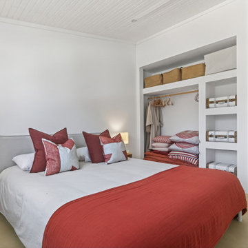 Double Bedroom with Open Wardrobe and Terracotta Textiles