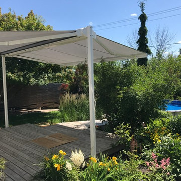 Free standing, dual-retracting awning
