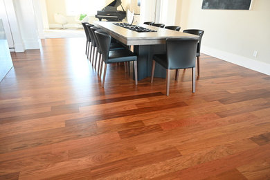 Kitchen/dining room combo - huge medium tone wood floor kitchen/dining room combo idea in Other with beige walls and no fireplace