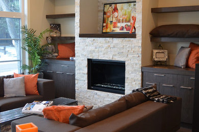 Example of a trendy living room design in Calgary with a stone fireplace