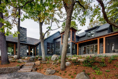 Inspiration for a large timeless blue two-story mixed siding house exterior remodel in Toronto with a clipped gable roof and a shingle roof