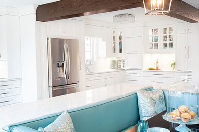 Inspiration for a large coastal u-shaped dark wood floor and brown floor eat-in kitchen remodel in Toronto with an undermount sink, recessed-panel cabinets, white cabinets, quartz countertops, gray backsplash, mosaic tile backsplash, stainless steel appliances, an island and gray countertops