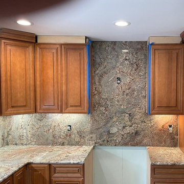 Typhoon Bordeaux Kitchen Countertops with Full Height Backsplashes