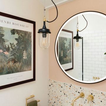 Pink & green bathroom with mix of tiles & patterns