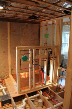 Walk in shower faucet placement