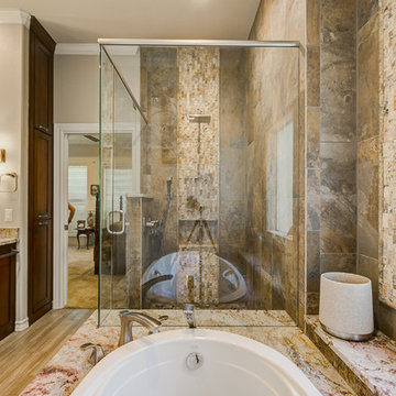 Warm Master Bathroom With Hints of the Outdoors