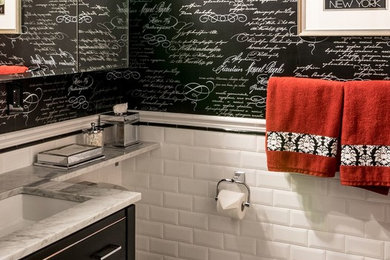Alcove shower - large traditional 3/4 black tile, black and white tile, white tile and subway tile porcelain tile and yellow floor alcove shower idea in New York with flat-panel cabinets, black cabinets, a one-piece toilet, multicolored walls, a drop-in sink and marble countertops
