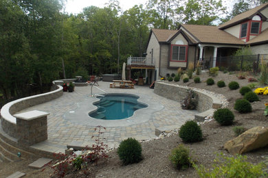 Inspiration for a contemporary concrete paver pool remodel in Cincinnati