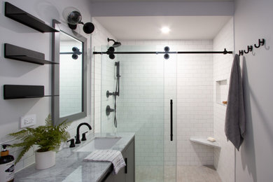 Example of a large classic master double-sink bathroom design in New York with gray cabinets and a freestanding vanity