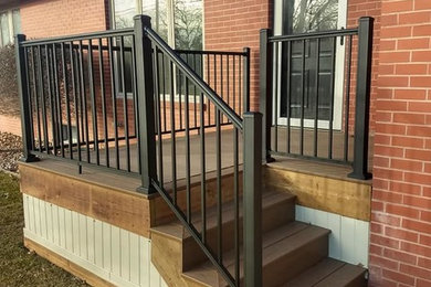 Example of a classic backyard deck design in Other