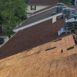 Old 3-Tab Shingle Removal on Entire Apartment Complex - Roofing And Gutters