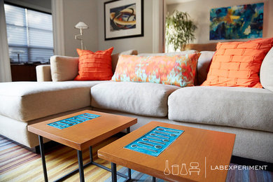 Example of a small trendy enclosed carpeted family room design in San Francisco with beige walls and a wall-mounted tv