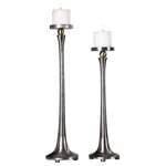 Uttermost - Aliso Candleholders, Set of 2 - This set of two candleholders features a sleek tapered design in solid cast iron with a subtle porous texture, sealed to preserve the natural finish and accented with gold infused highlights. Includes two 3"x 3" distressed off-white candles. Sizes: S-5x19x5, L-5x23x5