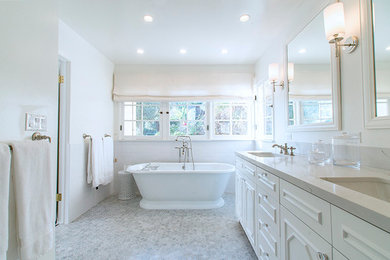 Inspiration for a large midcentury master bathroom in Los Angeles with furniture-like cabinets, white cabinets, a freestanding tub, an alcove shower, a bidet, gray tile, mosaic tile, white walls, mosaic tile floors, an undermount sink and marble benchtops.