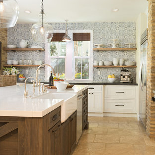 This is an example of a large country u-shaped open plan kitchen in San Diego with a farmhouse sink, recessed-panel cabinets, white cabinets, quartzite benchtops, blue splashback, cement tile splashback, stainless steel appliances, travertine floors, with island and beige floor.